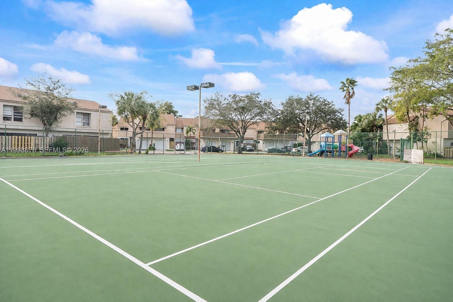 8243 Northwest 9th Street, Unit 7 Plantation, FL 33324 - Photo 27 of 30 a view of a tennis court