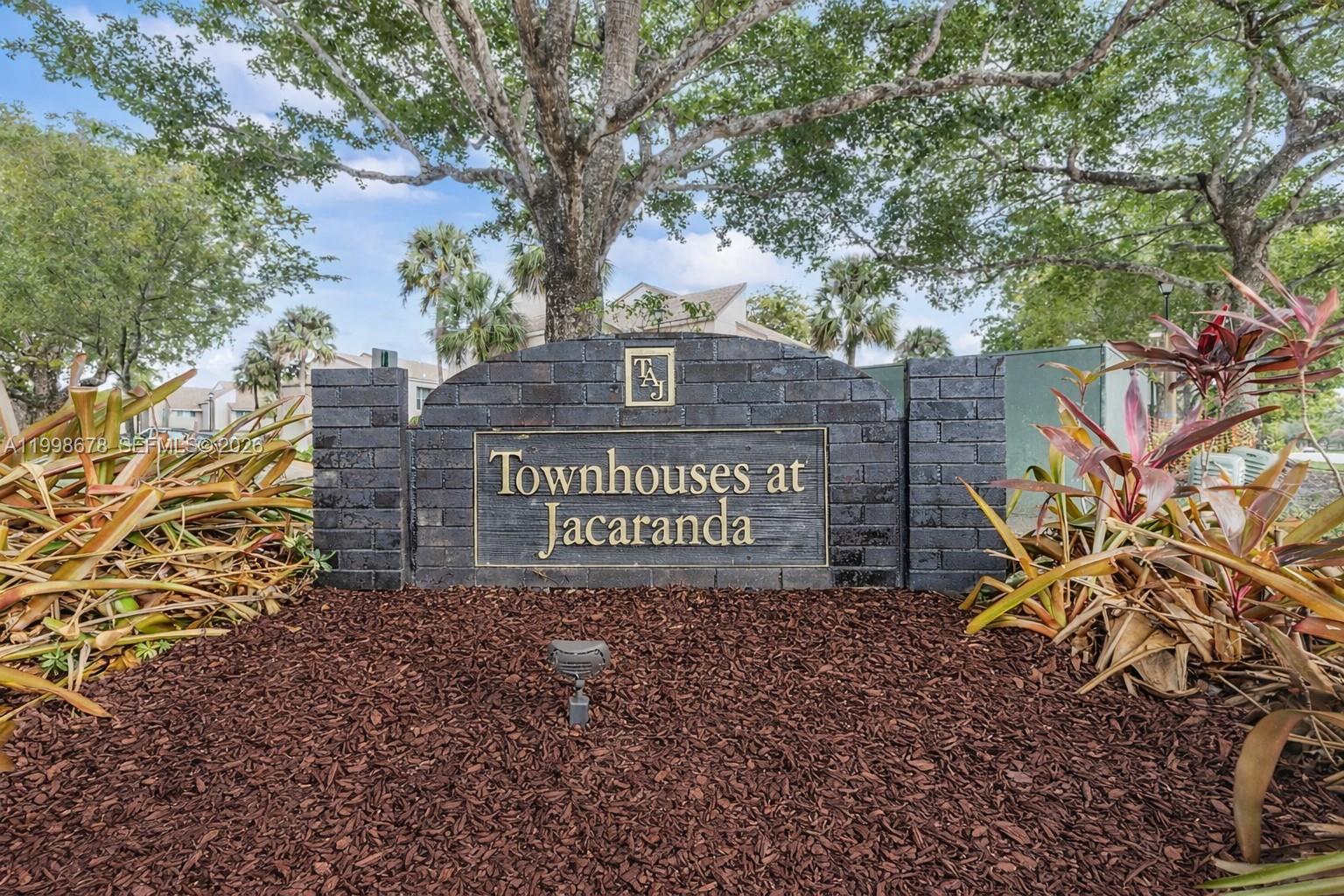 8243 Northwest 9th Street, Unit 7 Plantation, FL 33324 - Photo 30 of 30 a sign on the side of a building