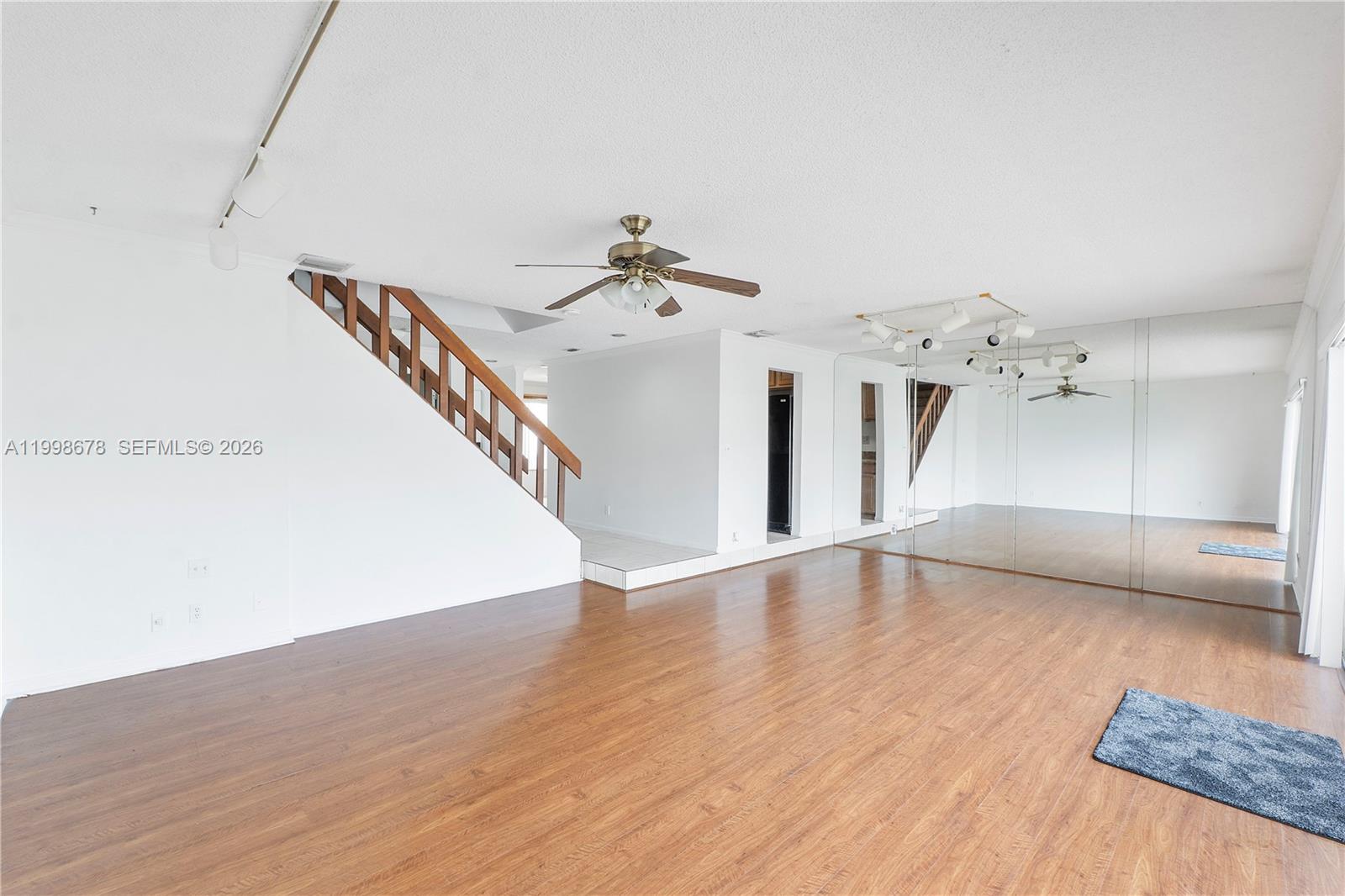 8243 Northwest 9th Street, Unit 7 Plantation, FL 33324 - Photo 4 of 30 a view of a ceiling fan with wooden floor