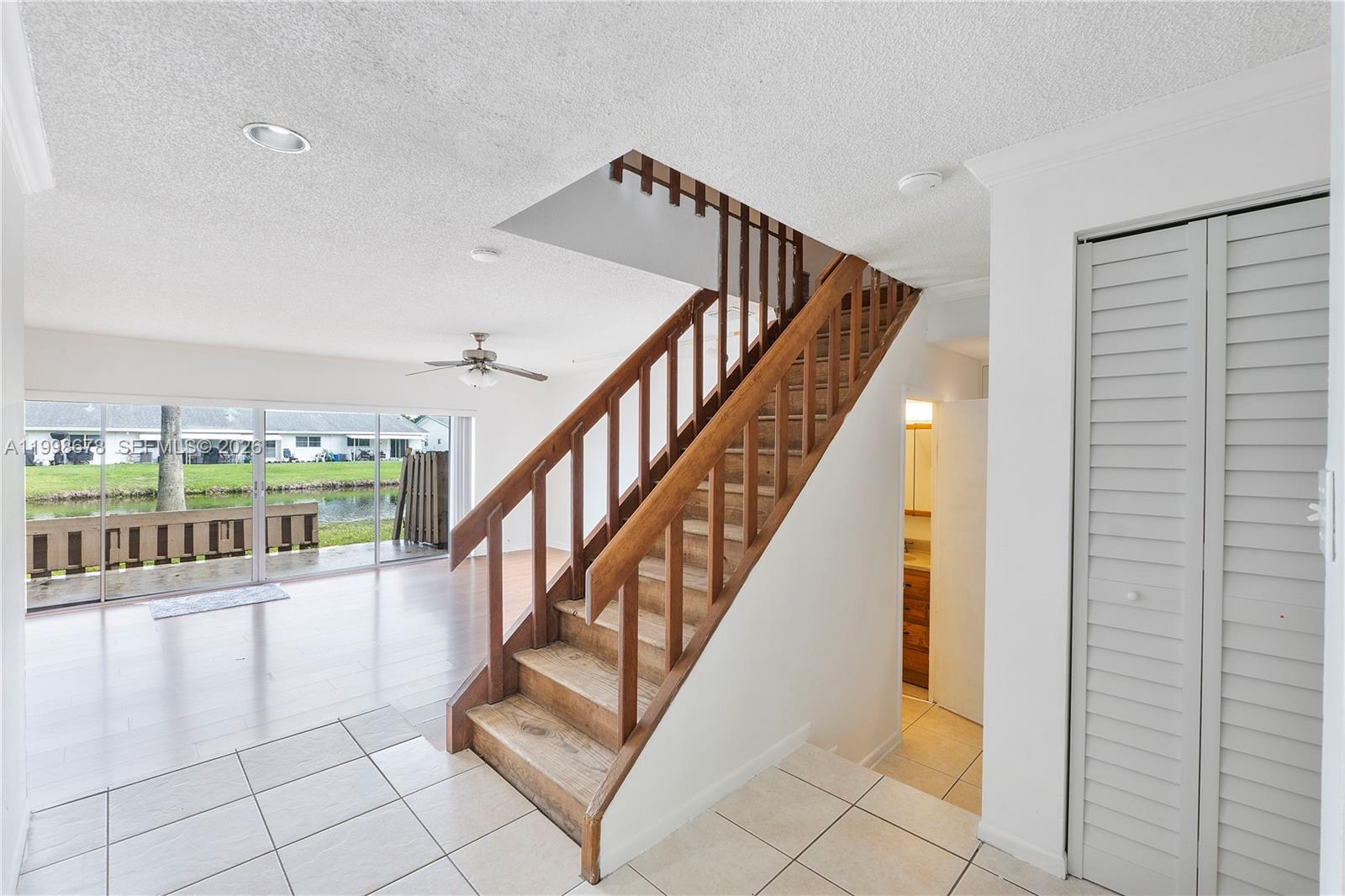 8243 Northwest 9th Street, Unit 7 Plantation, FL 33324 - Photo 5 of 30 a view of entryway and hall with wooden floor