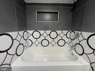 11064 Demarr Road White Plains, MD 20695 - Photo 54 of 98 a bathroom with a sink and a mirror