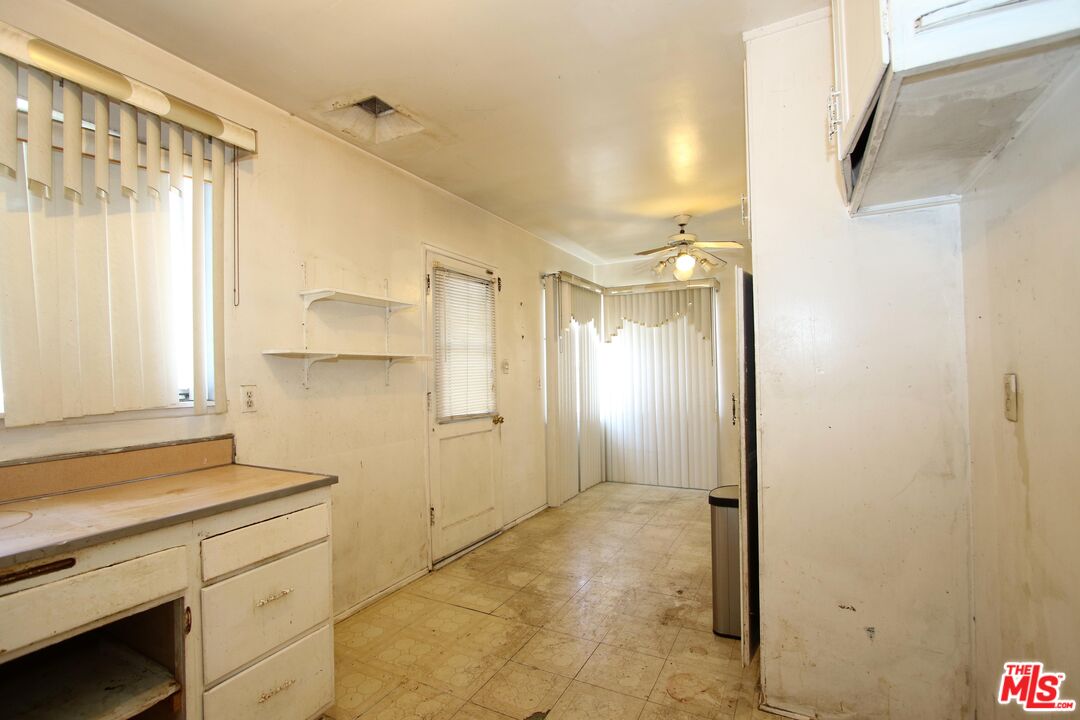 1022 West 156th Street Compton, CA 90220 - Photo 18 of 24 a bathroom with a shower and a sink