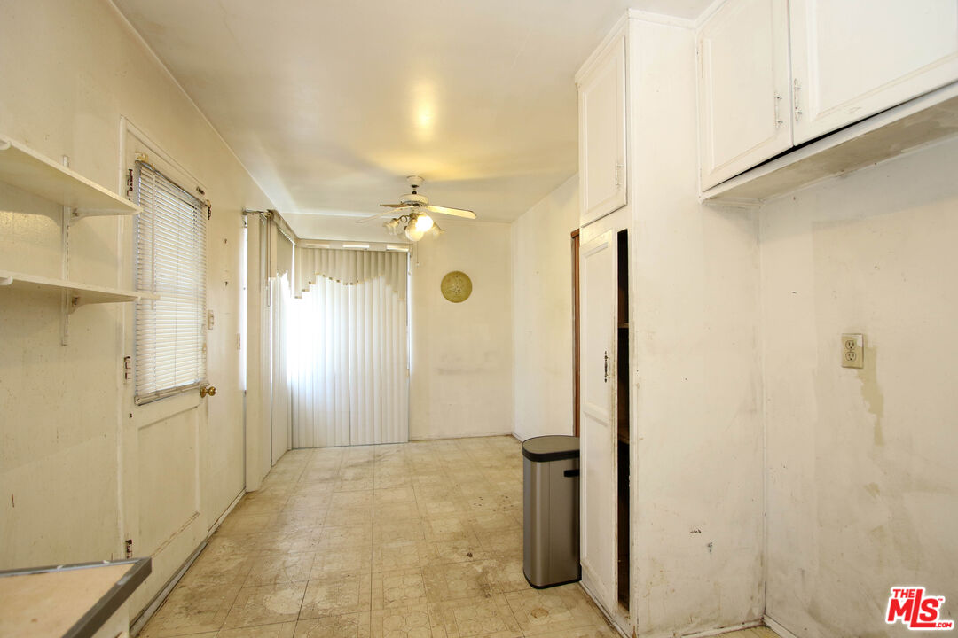 1022 West 156th Street Compton, CA 90220 - Photo 19 of 24 a view of a bathroom with a shower and a sink