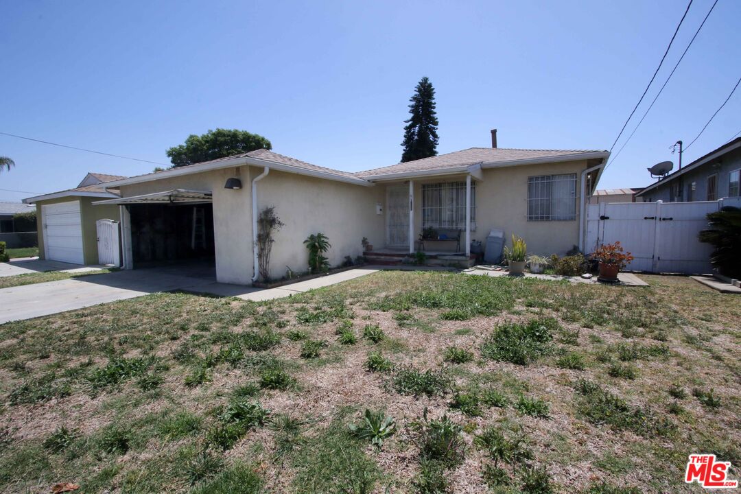1022 West 156th Street Compton, CA 90220 - Photo 4 of 24 a view of a house with a yard