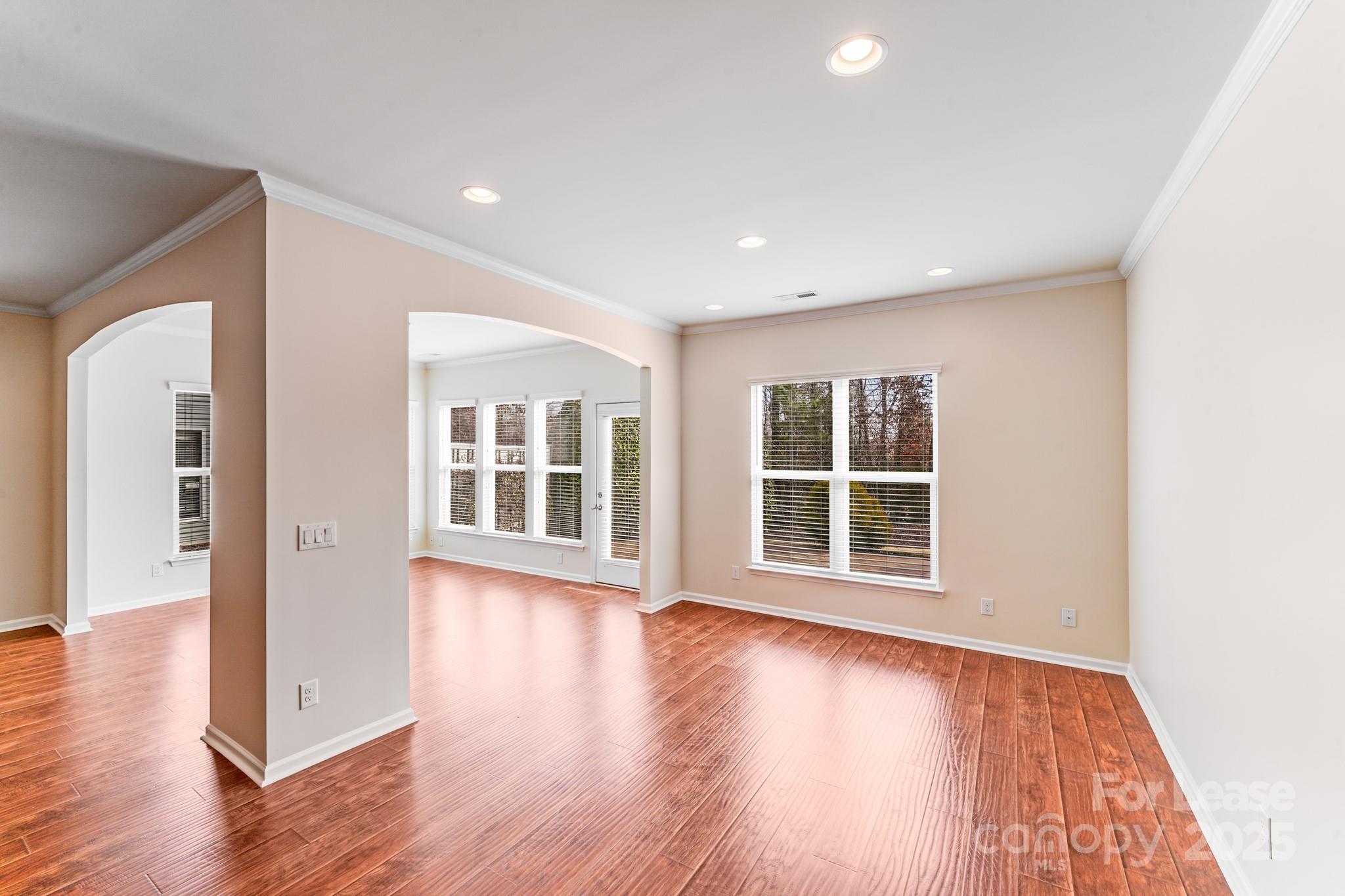 7012 Kitty Hawk Lane Fort Mill, SC 29707 - Photo 16 of 46 an empty room with wooden floor and windows