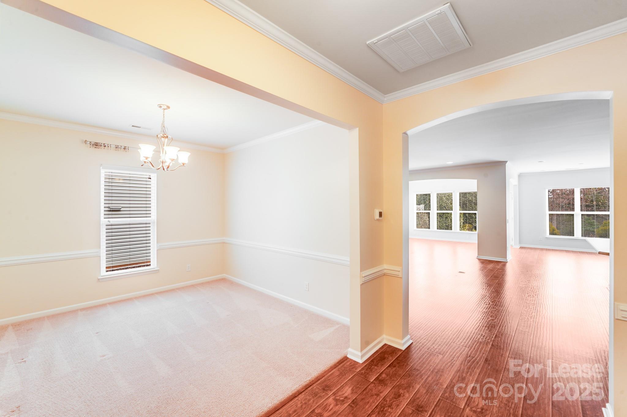 7012 Kitty Hawk Lane Fort Mill, SC 29707 - Photo 21 of 46 a view of empty room with wooden floor and fan