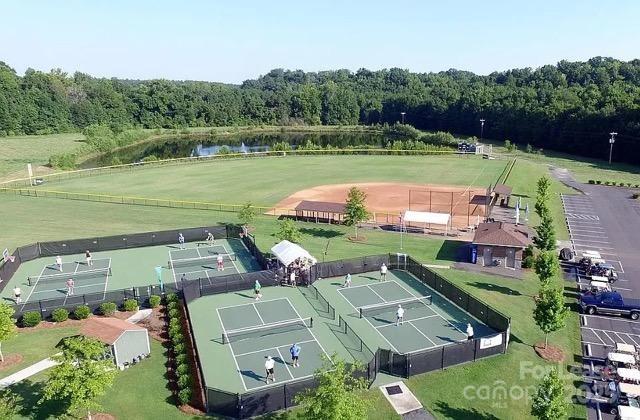 7012 Kitty Hawk Lane Fort Mill, SC 29707 - Photo 34 of 46 an aerial view of a house with a garden and lake view
