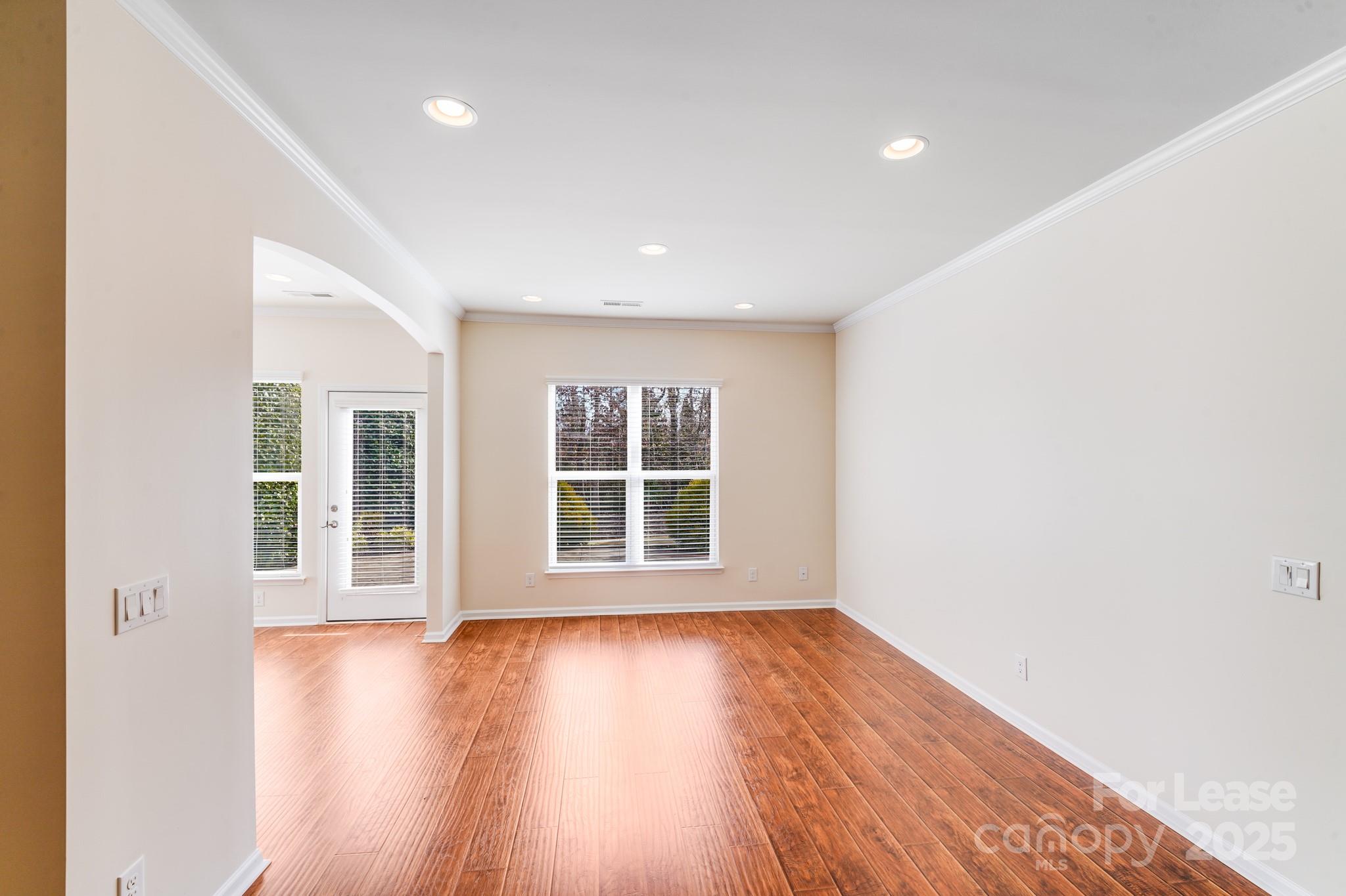 7012 Kitty Hawk Lane Fort Mill, SC 29707 - Photo 5 of 46 an empty room with wooden floor and windows