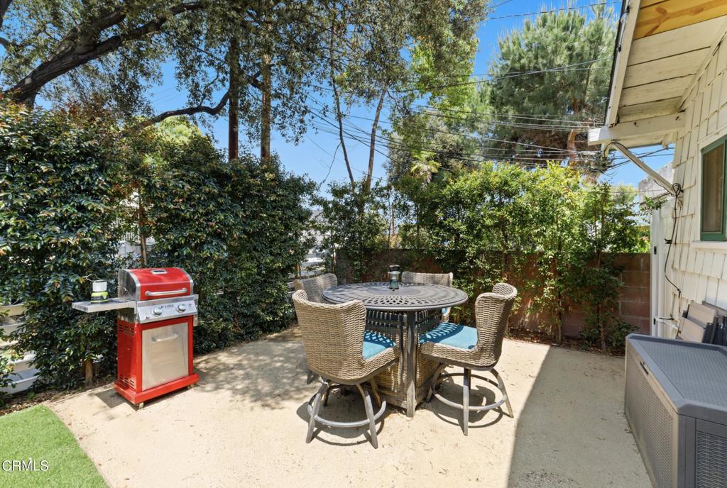 100 Palmetto Drive, Unit 2 Pasadena, CA 91105 - Photo 18 of 21 a view of a chairs and table in backyard