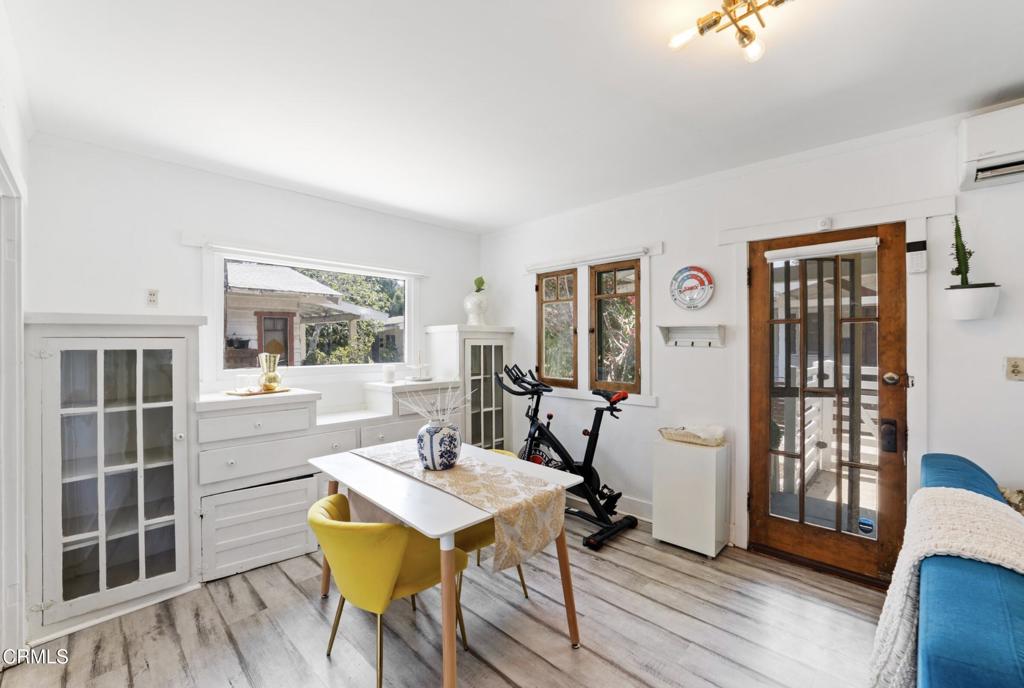 100 Palmetto Drive, Unit 2 Pasadena, CA 91105 - Photo 7 of 21 a view of a dining room with furniture and wooden floor