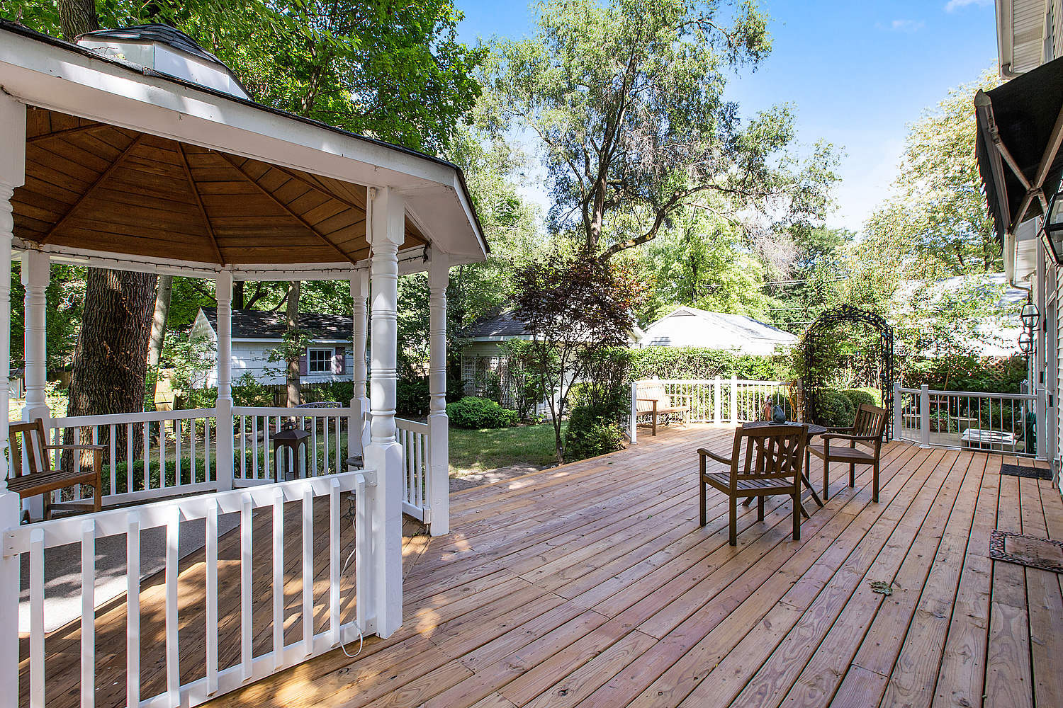1230 Ridge Road Homewood, IL 60430 - Photo 22 of 28 a view of patio with table and chairs under an umbrella with wooden floor