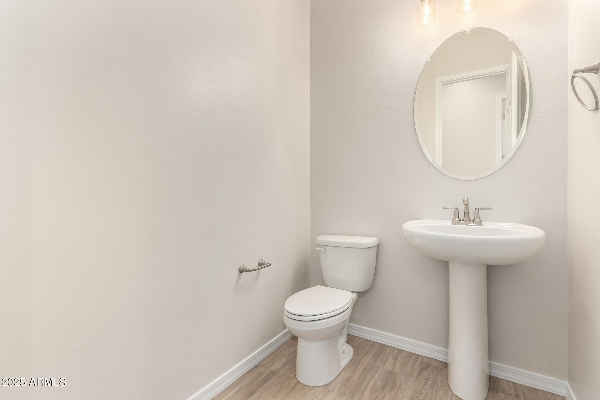 4818 West Capistrano Avenue Laveen, AZ 85339 - Photo 11 of 44 a bathroom with a toilet sink and mirror
