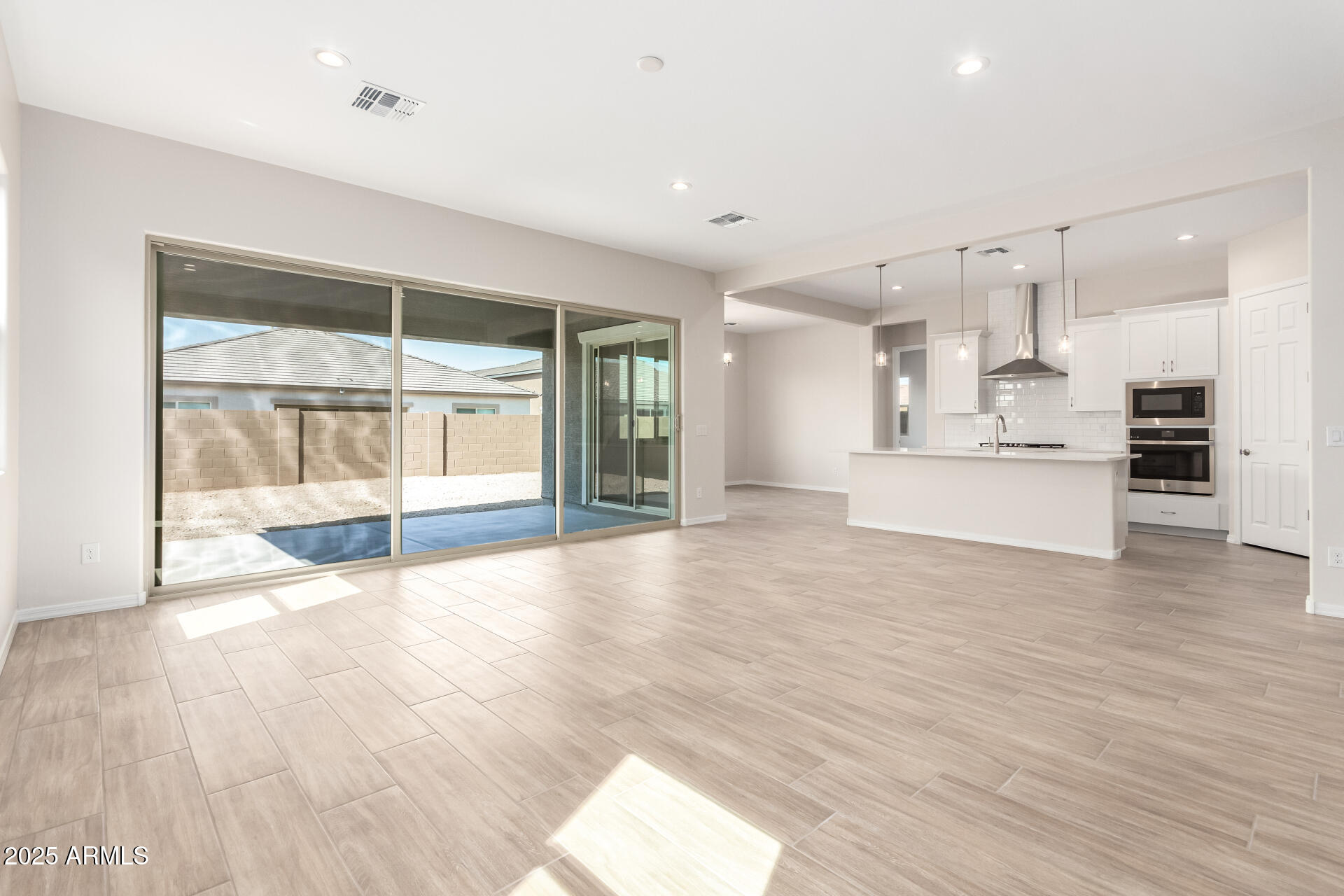 4818 West Capistrano Avenue Laveen, AZ 85339 - Photo 12 of 44 a view of a kitchen with wooden floor and a kitchen