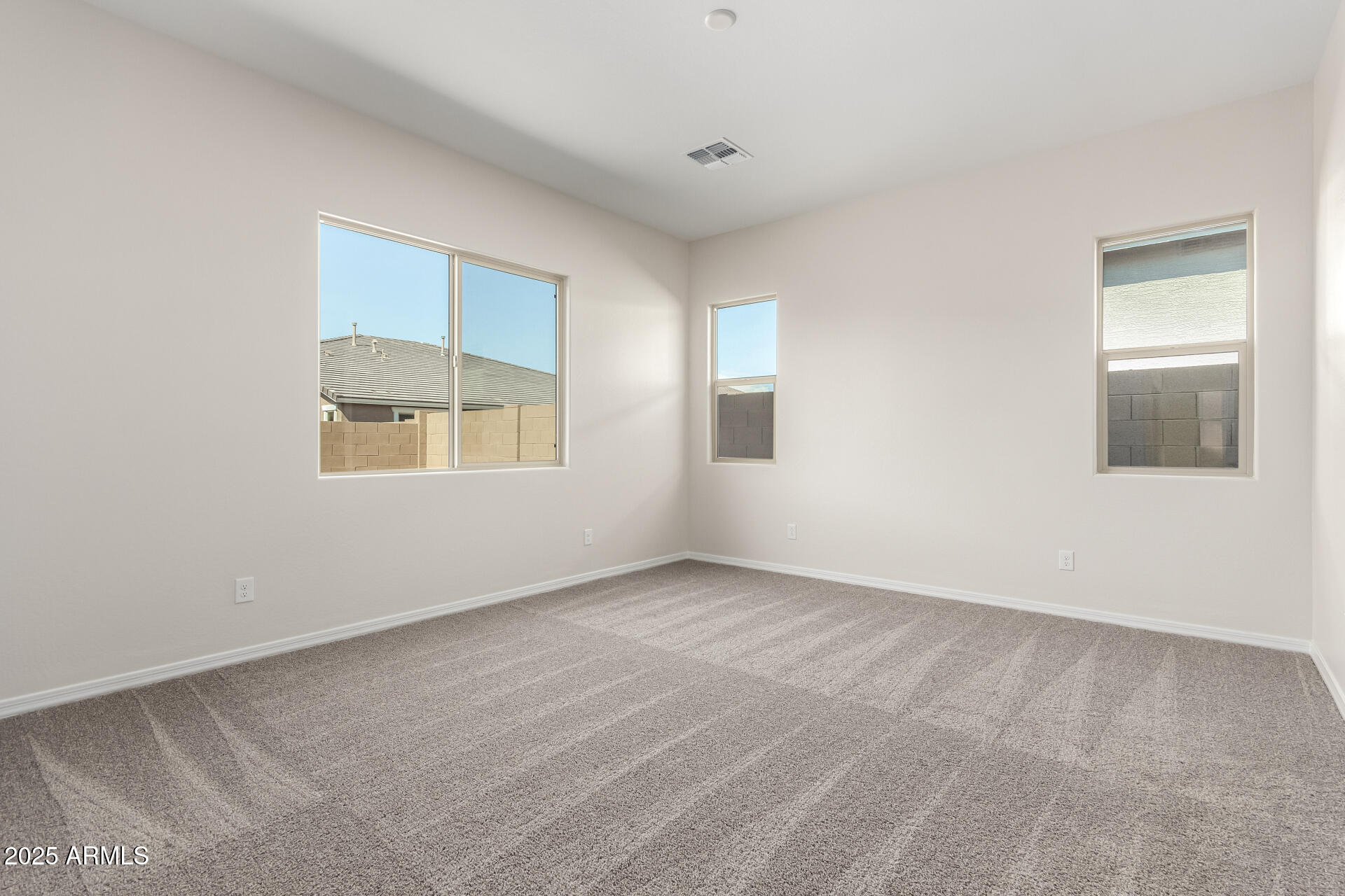 4818 West Capistrano Avenue Laveen, AZ 85339 - Photo 13 of 44 a view of an empty room with a window