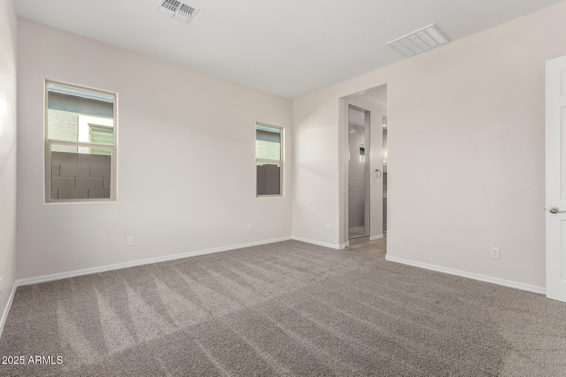 4818 West Capistrano Avenue Laveen, AZ 85339 - Photo 14 of 44 a view of an empty room with a window