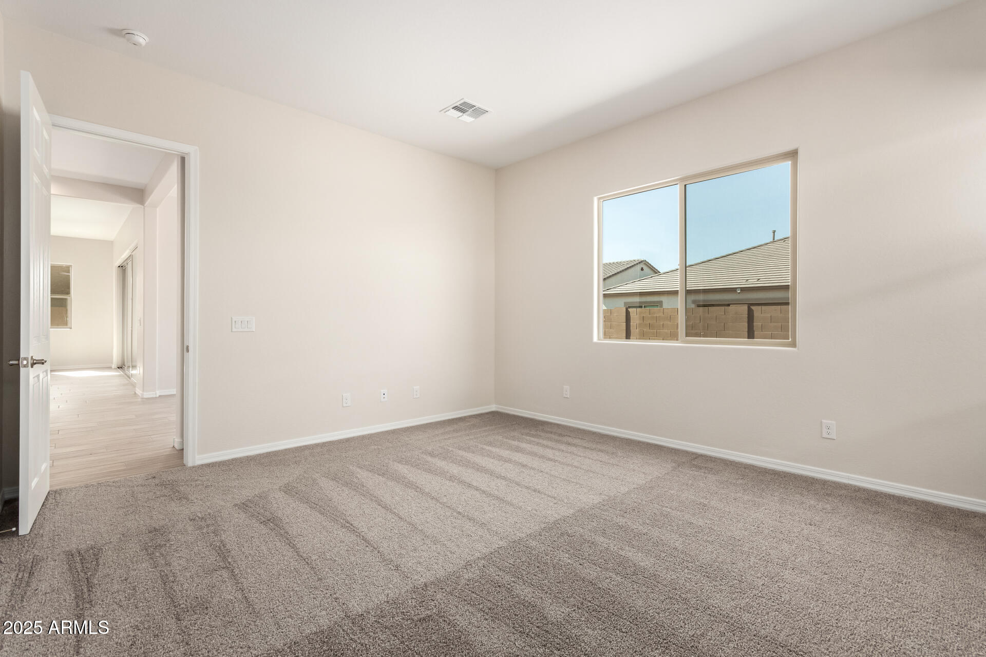 4818 West Capistrano Avenue Laveen, AZ 85339 - Photo 16 of 44 an empty room with windows and closet