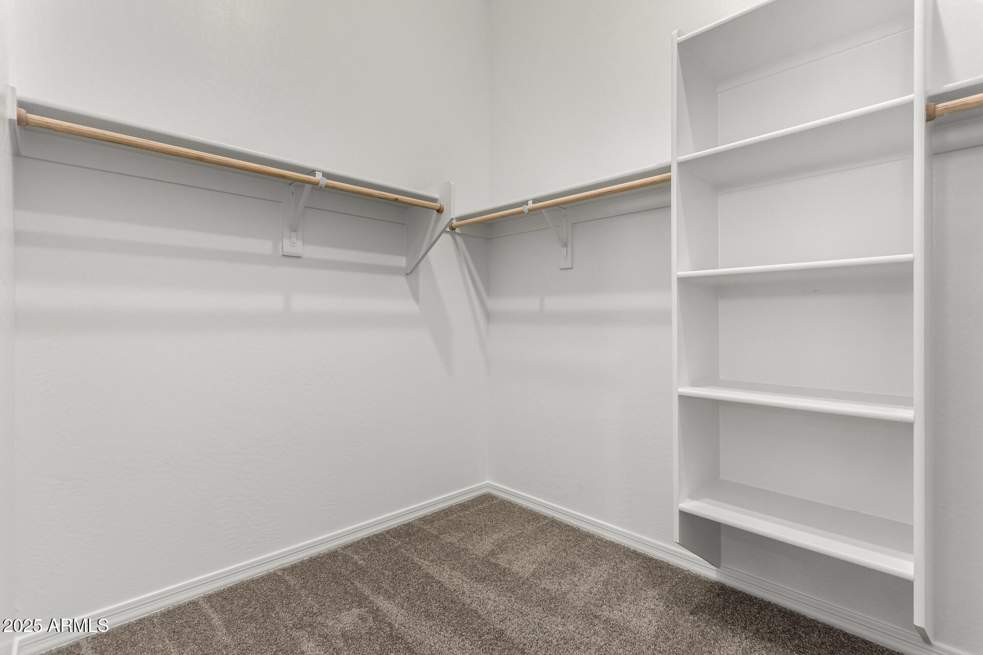 4818 West Capistrano Avenue Laveen, AZ 85339 - Photo 20 of 44 a view of an empty walk in closet