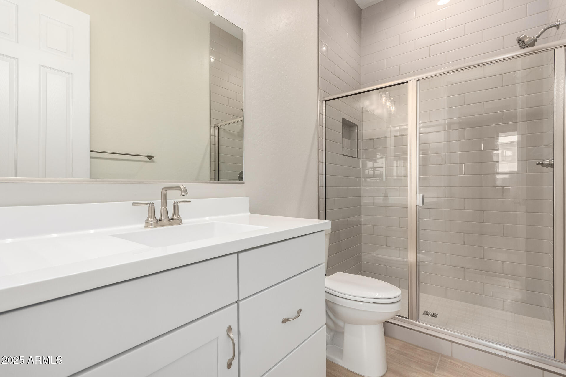4818 West Capistrano Avenue Laveen, AZ 85339 - Photo 25 of 44 a bathroom with a sink toilet and shower
