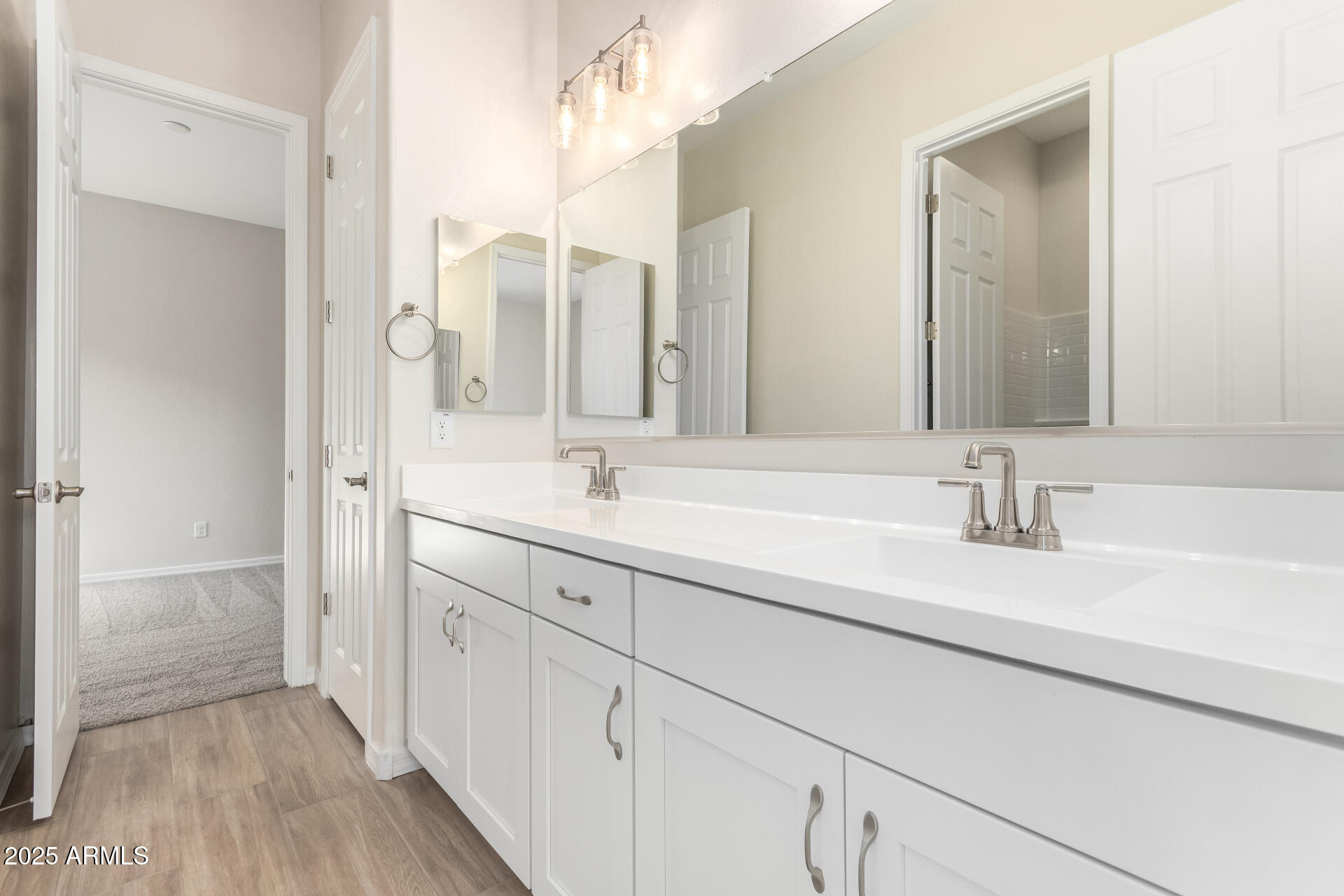 4818 West Capistrano Avenue Laveen, AZ 85339 - Photo 28 of 44 a bathroom with a double vanity sink mirror and