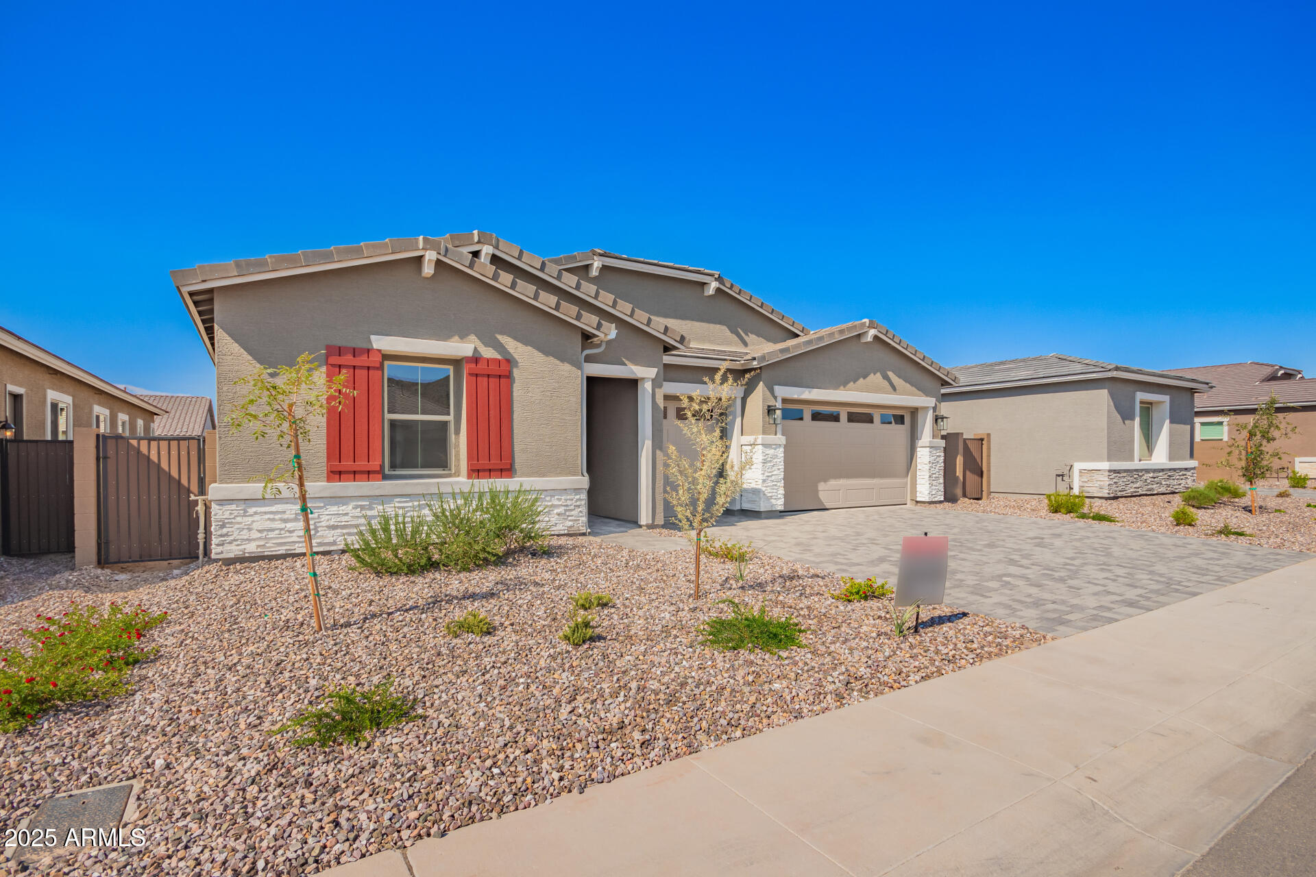 4818 West Capistrano Avenue Laveen, AZ 85339 - Photo 43 of 44 a front view of a house with a garden and yard