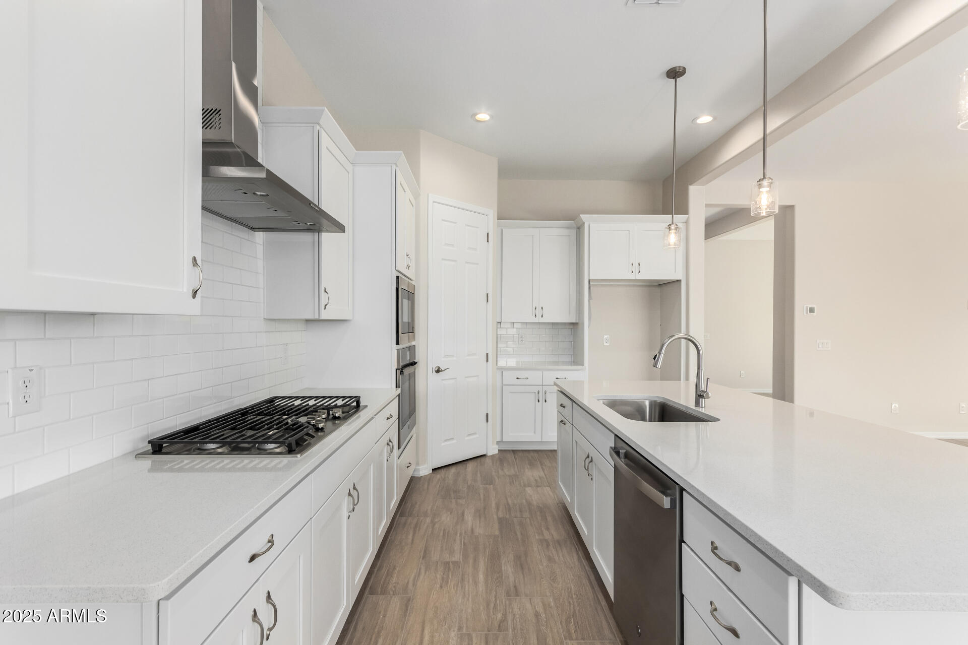 4818 West Capistrano Avenue Laveen, AZ 85339 - Photo 4 of 44 a kitchen with a sink a stove and cabinets