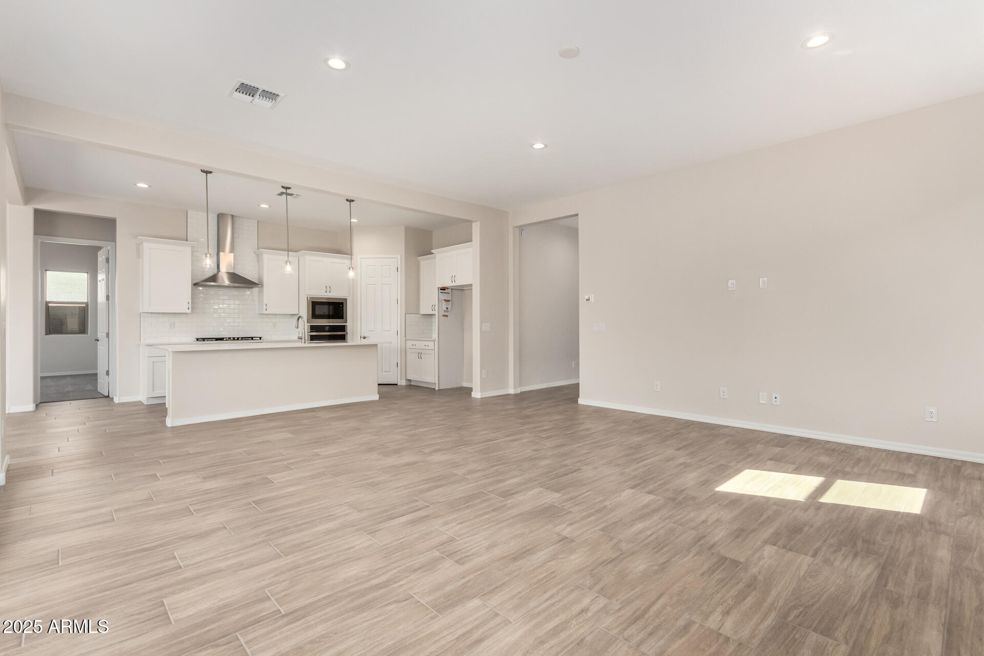 4818 West Capistrano Avenue Laveen, AZ 85339 - Photo 9 of 44 a view of kitchen with wooden floor