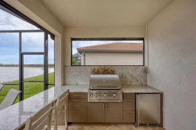 a living room with furniture a mirror and a flat screen tv