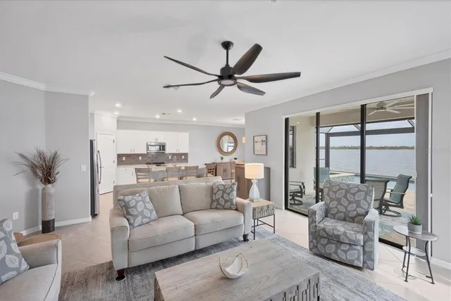 a view of a livingroom with workspace and a window