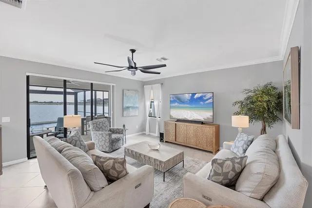 a workspace with furniture and a floor to ceiling window