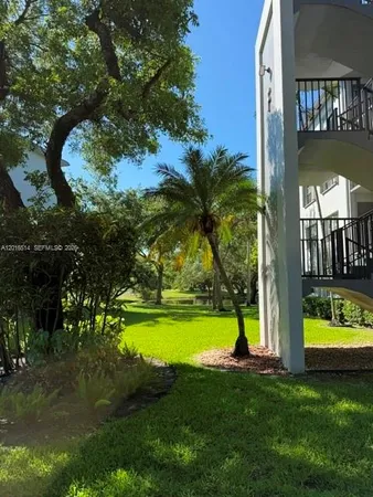 a view of a swimming pool with a yard