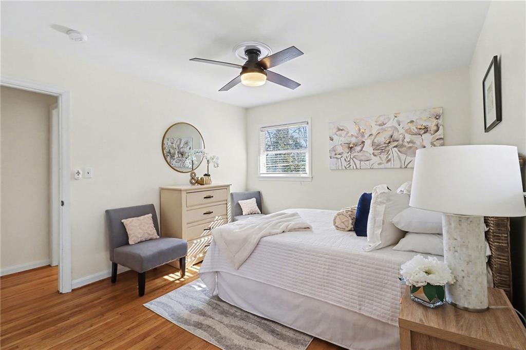 490 East Pharr Road Decatur, GA 30030 - Photo 15 of 33 a bedroom with a bed and wooden floor