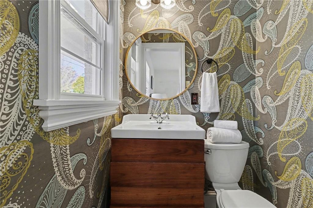 490 East Pharr Road Decatur, GA 30030 - Photo 16 of 33 a bathroom with a toilet sink and mirror