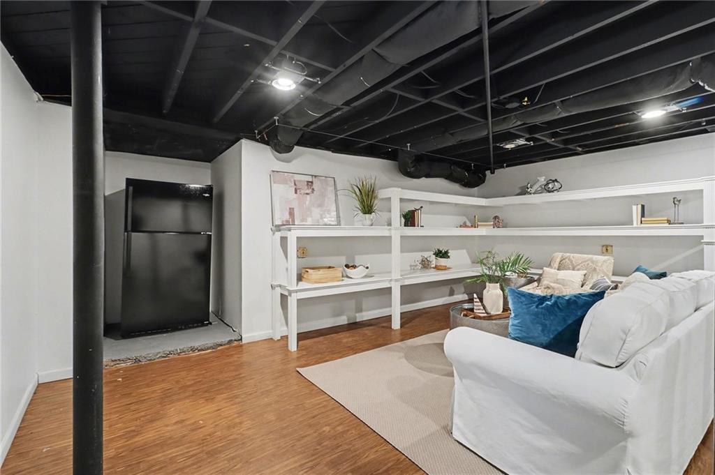 490 East Pharr Road Decatur, GA 30030 - Photo 22 of 33 a living room with furniture and a wooden floor