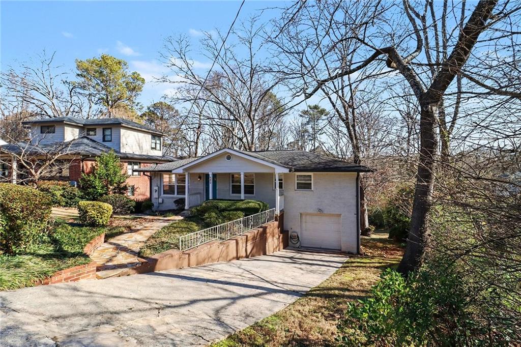 490 East Pharr Road Decatur, GA 30030 - Photo 4 of 33 a front view of a house with a yard