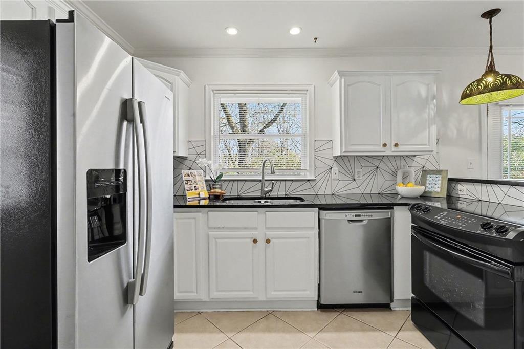 490 East Pharr Road Decatur, GA 30030 - Photo 10 of 33 a kitchen with granite countertop a refrigerator and a sink