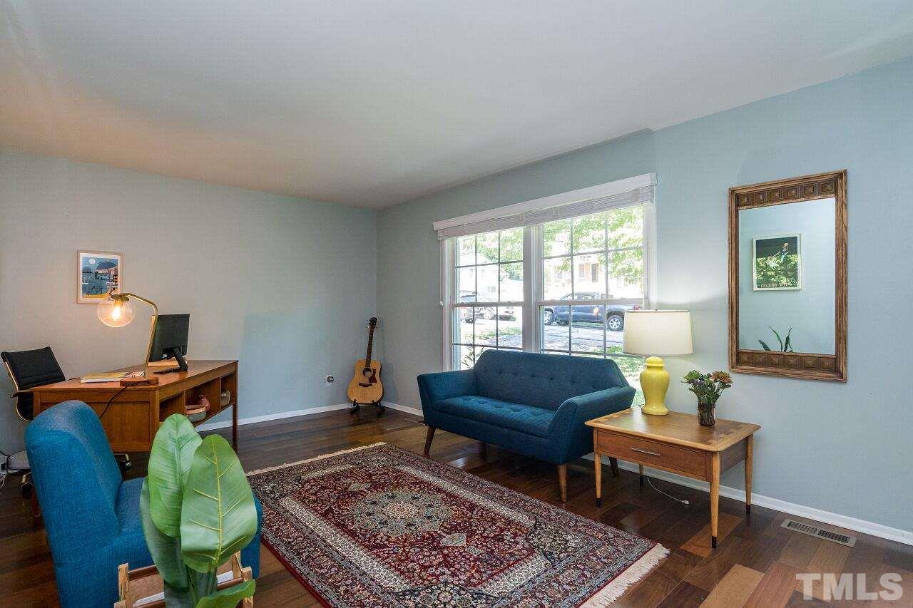 1012 Belfast Drive Raleigh, NC 27610 - Photo 4 of 30 a living room with furniture and a window