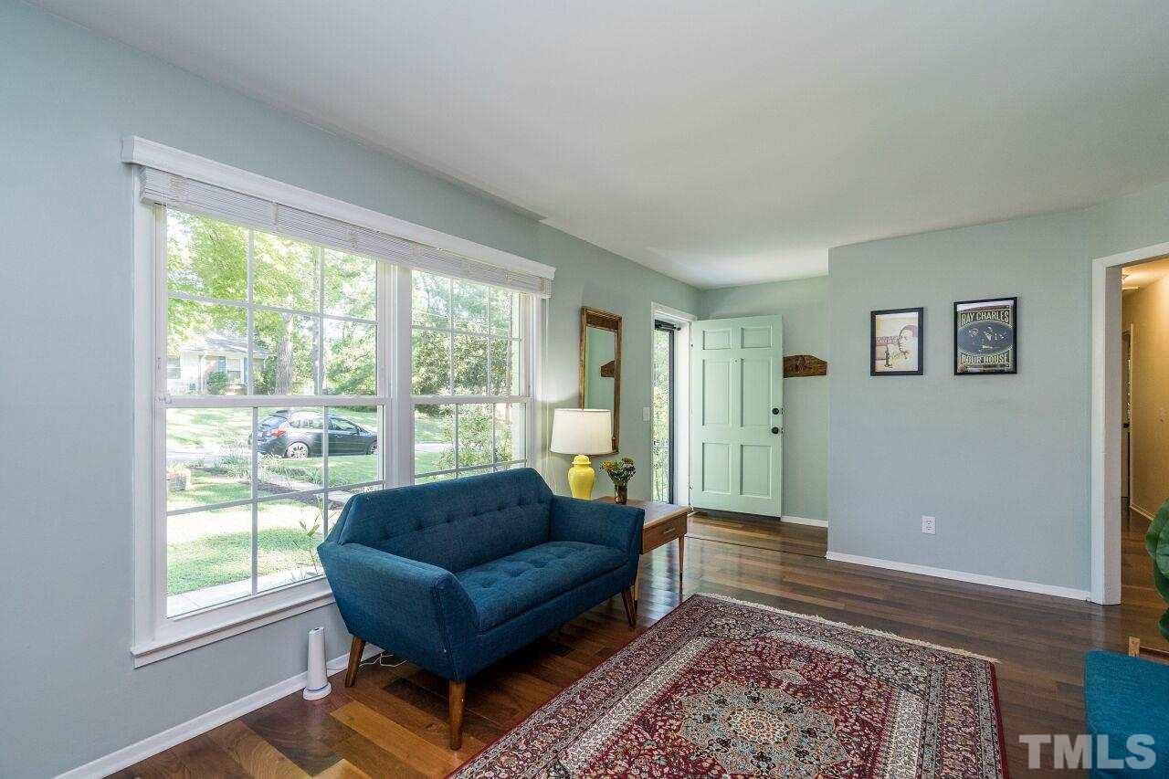 1012 Belfast Drive Raleigh, NC 27610 - Photo 5 of 30 a living room with furniture and a rug