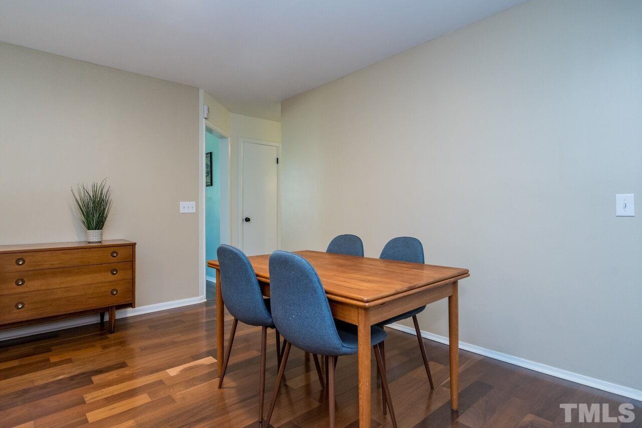 1012 Belfast Drive Raleigh, NC 27610 - Photo 7 of 30 a view of a workspace with furniture and wooden floor