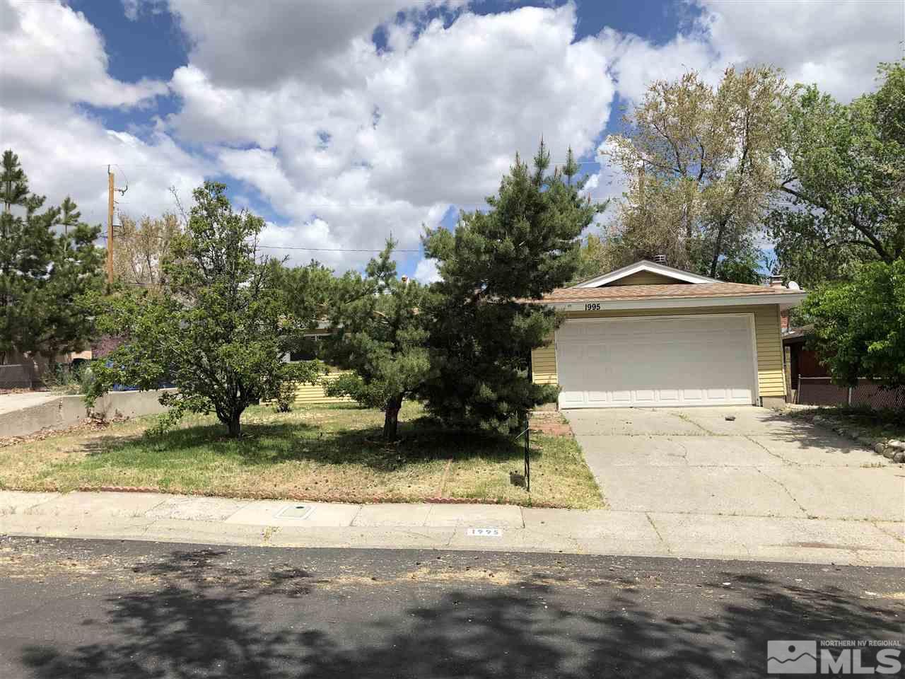 1995 Arcane Avenue Reno, NV 89503 - Photo 1 of 9 a front view of a house with a yard