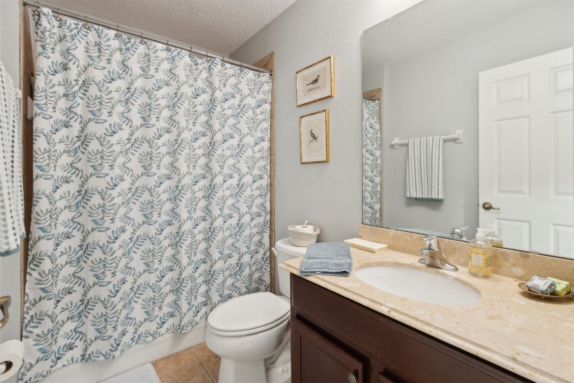 95275 Poplar Way Fernandina Beach, FL 32034 - Photo 21 of 38 a bathroom with a granite countertop sink toilet and a mirror