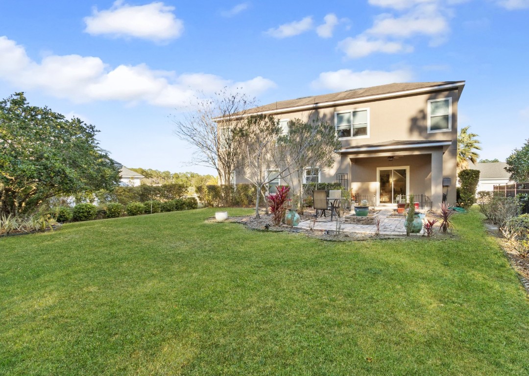 95275 Poplar Way Fernandina Beach, FL 32034 - Photo 28 of 38 a view of a house with backyard sitting area and garden