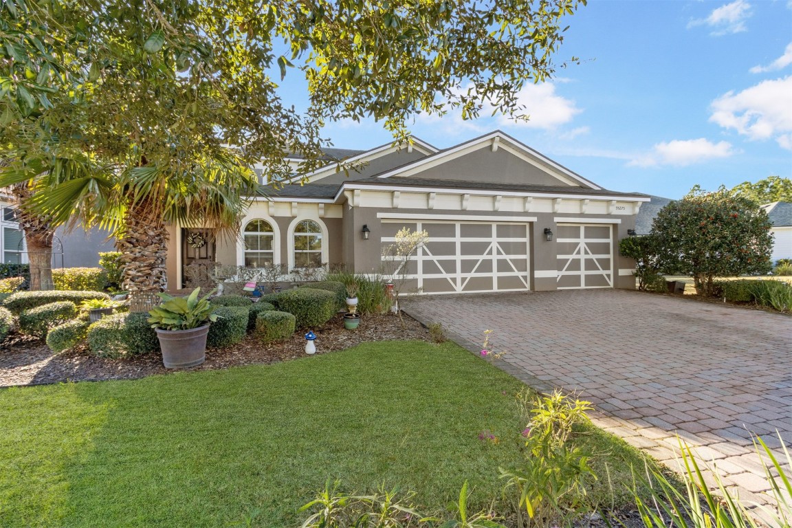 95275 Poplar Way Fernandina Beach, FL 32034 - Photo 5 of 38 a view of a house with backyard and garden
