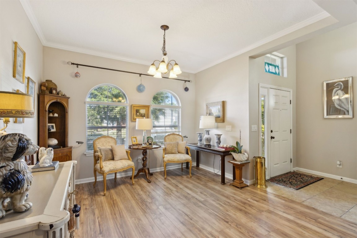 95275 Poplar Way Fernandina Beach, FL 32034 - Photo 6 of 38 a living room with furniture or chandelier and a wooden floor
