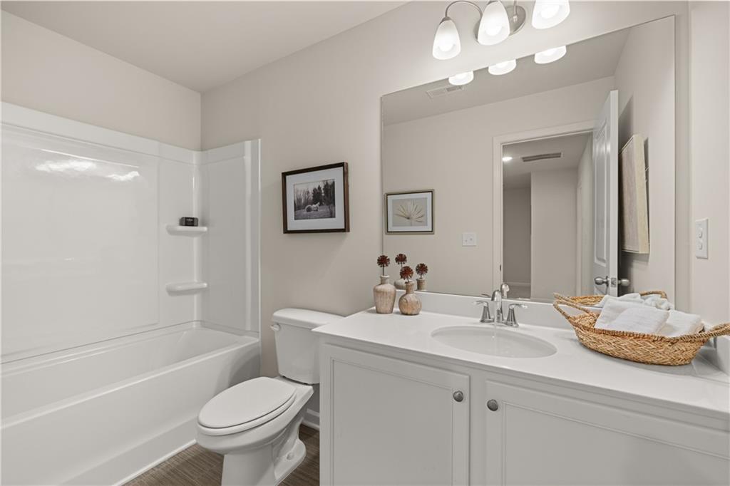 1035 Merritt Drive, Unit 94 Villa Rica, GA 30180 - Photo 13 of 49 a bathroom with a sink toilet tub and shower