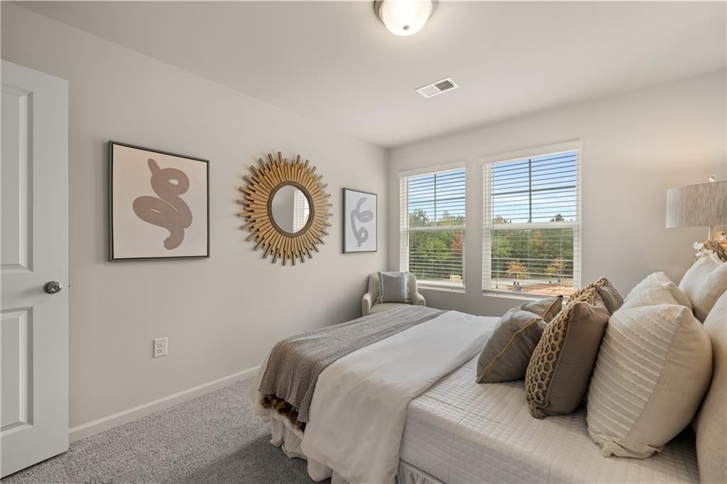 1035 Merritt Drive, Unit 94 Villa Rica, GA 30180 - Photo 19 of 49 a bedroom with a bed and a window