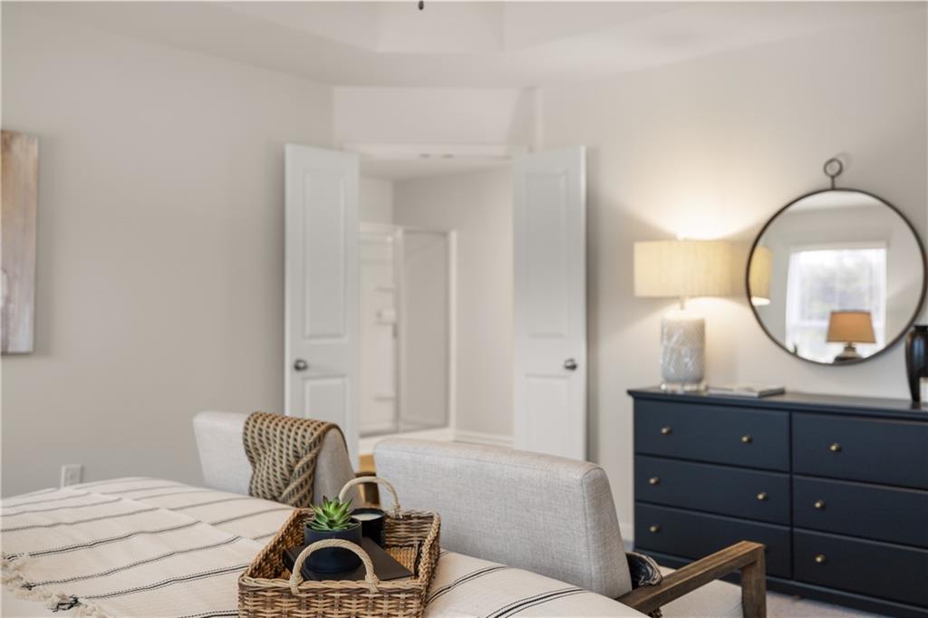 1035 Merritt Drive, Unit 94 Villa Rica, GA 30180 - Photo 34 of 49 a bedroom with a bed and a dresser