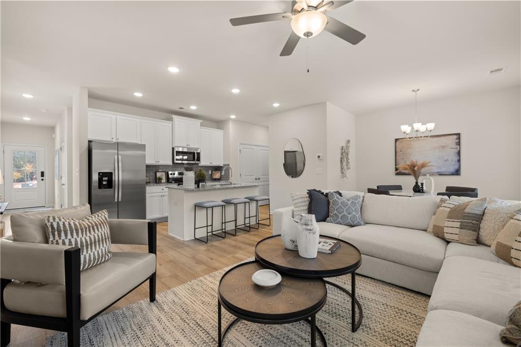 1035 Merritt Drive, Unit 94 Villa Rica, GA 30180 - Photo 40 of 49 a living room with furniture kitchen and a dining table