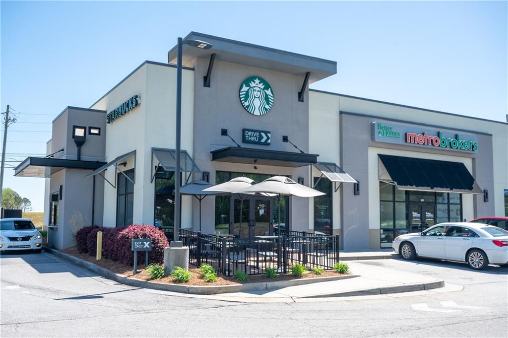 1035 Merritt Drive, Unit 94 Villa Rica, GA 30180 - Photo 48 of 49 a view of a building with a patio and a fireplace