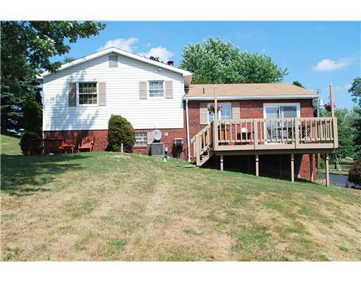 141 Glendale Road Beaver Falls, PA 15010 - Photo 18 of 18 Exterior Back. Large deck with steps to yard. Access from dining area.