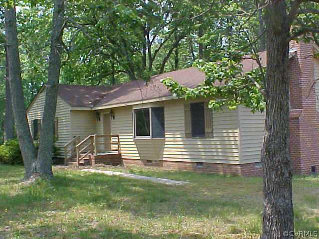 1130 Dispatch Road Quinton, VA 23141 - Photo 1 of 5 a view of a house with a yard
